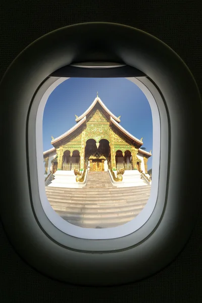 The window of airplane with travel destination attraction. Luang