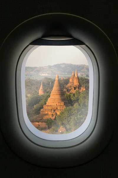 The window of airplane with travel destination attraction. Myanm