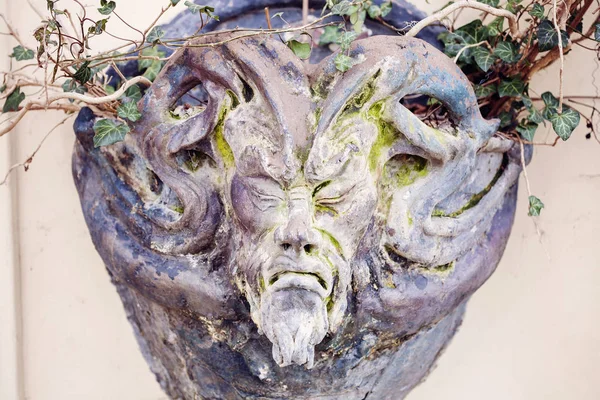 Satyr Woodland god face sculpture