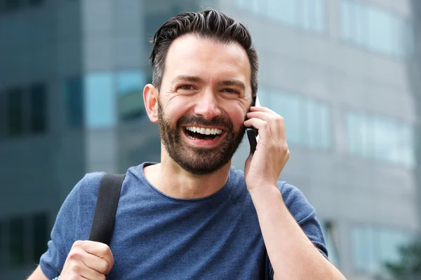 Handsome mature man using cell phone