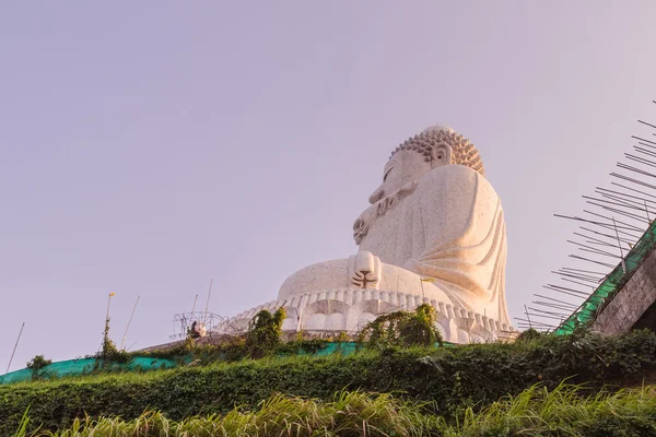 Side view of Phuket Big Buddha Statue while surrounding area under construction