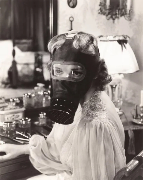 Woman wearing gas mask