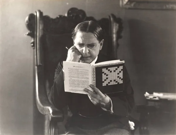 Man studying a crossword