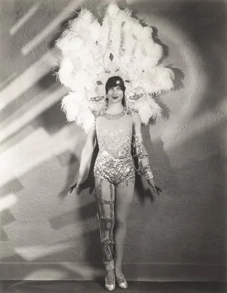 Woman wearing feather headdress