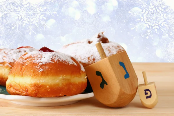 Image of jewish holiday Hanukkah with donuts