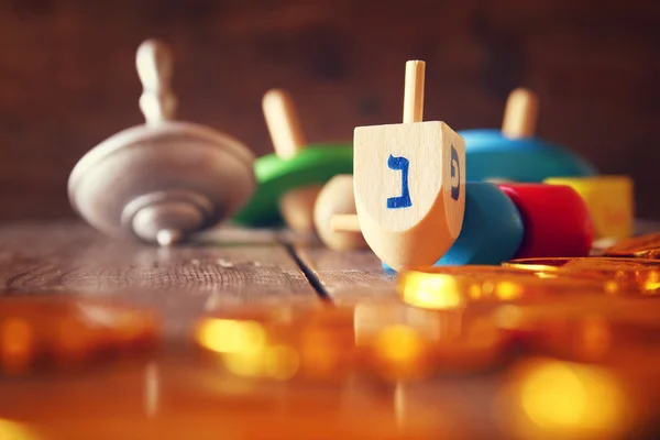 Image of jewish holiday Hanukkah with wooden dreidels