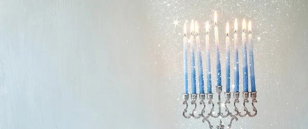 Jewish holiday Hanukkah background with menorah