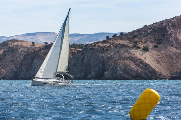 Sailing yacht on finish