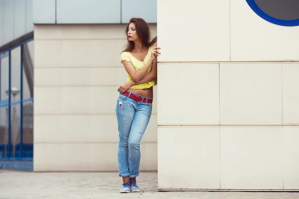 Full length portrait of serious hipster girl wearing trendy clothing