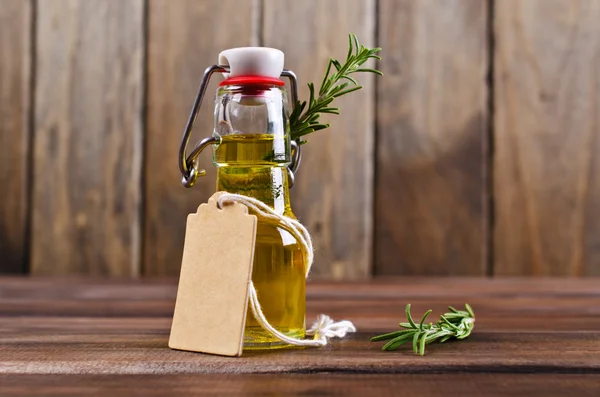 Oil with dry leaves of rosemary