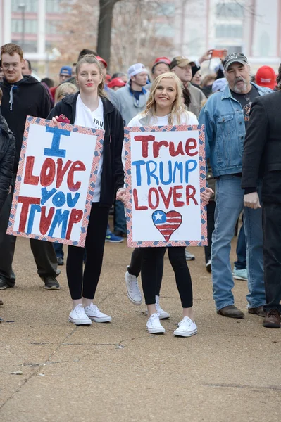 Young Trump Supporters Show Signs Outside Rally