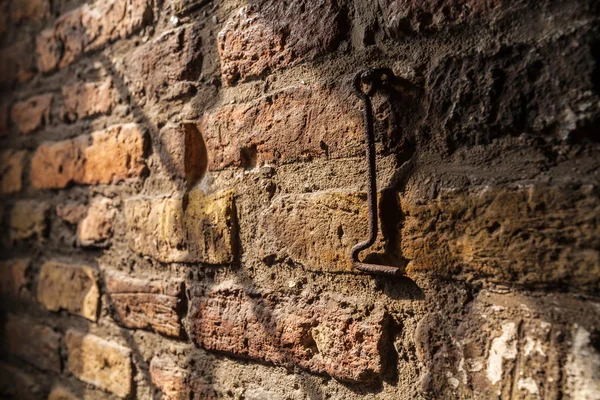 Ancient brick wall and the hook inside the new Church in Delft,
