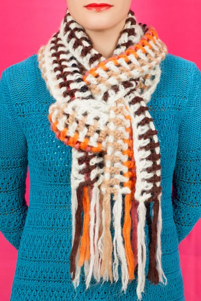 Silk scarf. Beige silk scarf around her neck isolated on pink background.