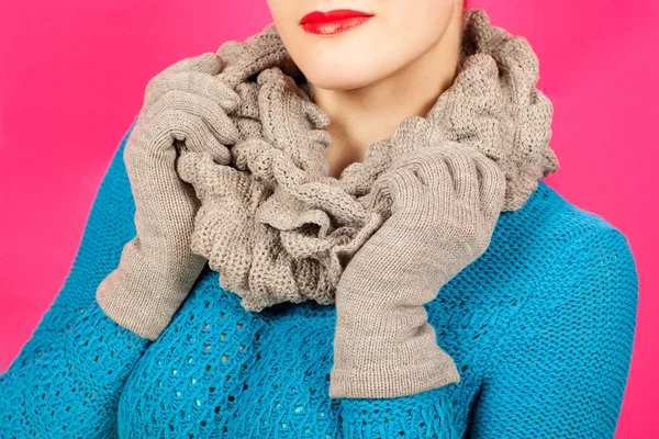 Silk scarf. Beige silk scarf around her neck isolated on pink background.