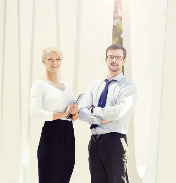 Young businesswoman and businessman couple in formal clothes