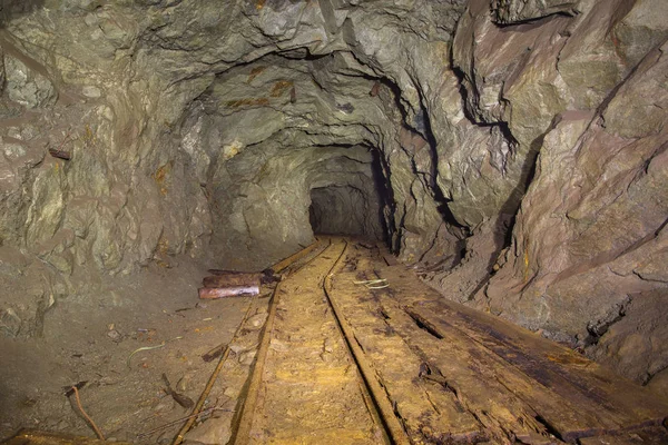 Old abandoned underground gold mine tunnel