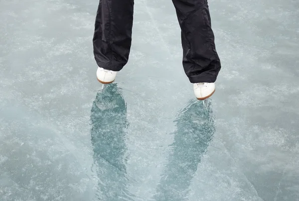 Skating on the ice of Lake Baikal in March under the rain