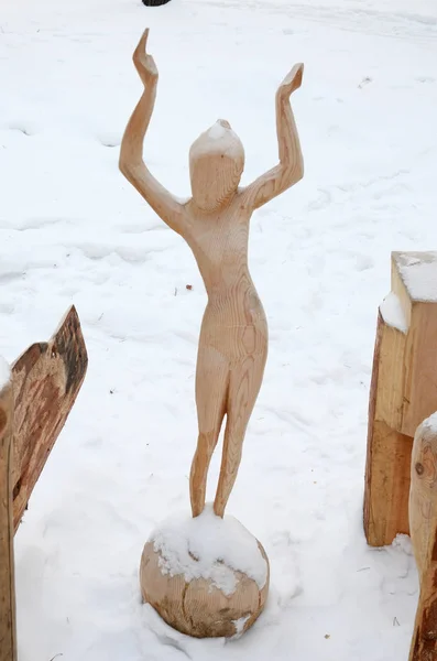 Irkutsk Region,Russia-Jan, 03 2015: Girl on the Ball. Park of wooden sculptures in Savvateevka Village
