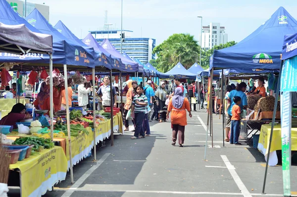 KUANTAN - JULY 7 : Shoppers at a farmers market on July 7, 2013 in Kuantan, Pahang. Farmers market in kuantan is the most visited people in Pahang.