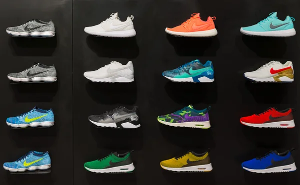 Johannesburg, South Africa - September 12, 2016: Colorful Nike footwears exhibition on black shelf in store of Johannesburg, South Africa. Nike Inc. is an American multinational corporation for the de