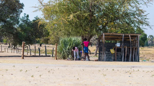 Caprivi, Namibia - August 20, 2016: Poor people working in their village in the rural Caprivi Strip, the most populated region in Namibia, Africa.