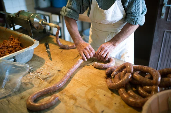 Man making sausages at kitchen
