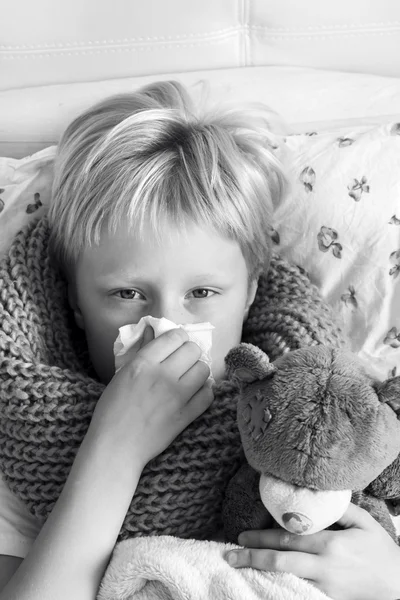 Sick child with teddy bear