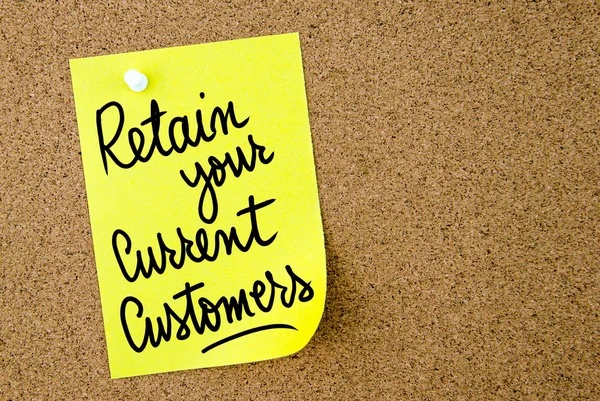 Retain Your Current Customers text written on yellow paper note
