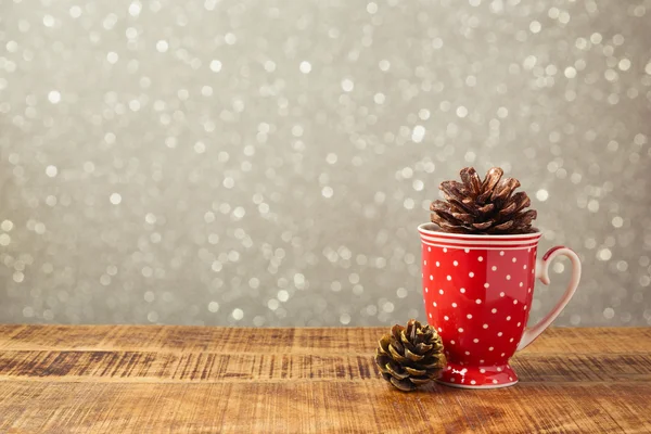 Cup and pine corns decoration