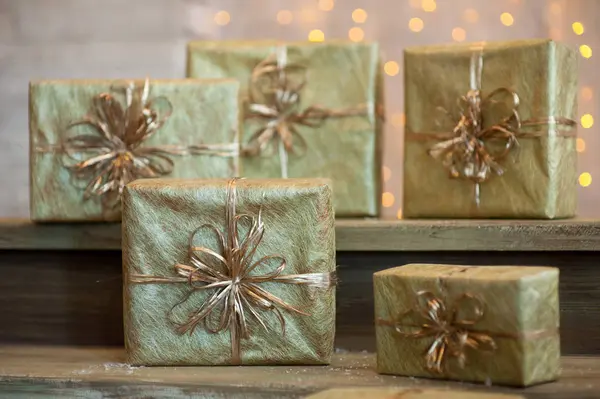 Golden gift boxes on abstract background