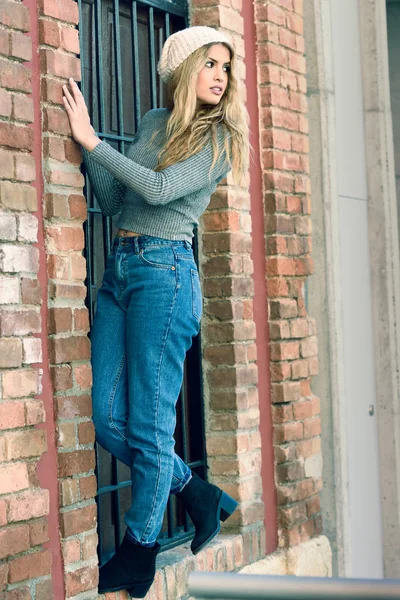 Young woman wearing casual clothes smiling in urban background