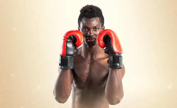 Handsome black man with boxing gloves