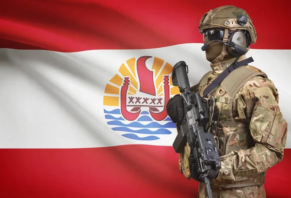 Soldier in helmet holding machine gun with flag on background series - French Polynesia