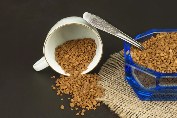 Instant coffee in a glass dish. Preparation of soluble coffee. Decorate store coffee.