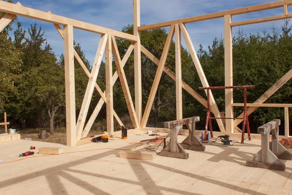 Wooden frame of house under construction.Framed New Construction of a House. Timber house in building process