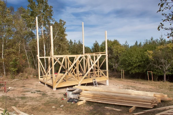 Construction of ecological house. Wooden frame of house under construction.Framed New Construction of a House. Timber house in building process