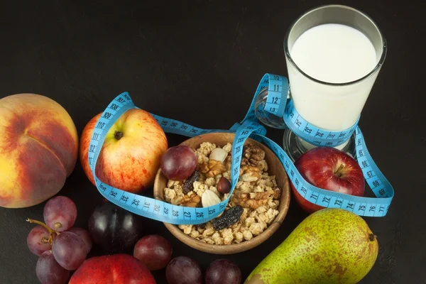 Oatmeal, fruit and a glass of milk. Diet food. Nutritious food for athletes. Healthy diet. Traditional breakfast.