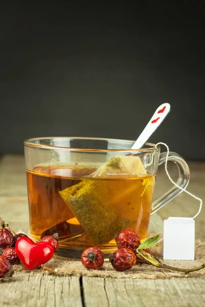 Hot tea for colds. Traditional home treatment for colds and flu. Rosehip tea, honey and citrus. Home Pharmacy. Proven treatment of diseases.