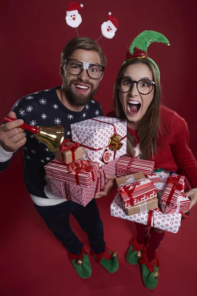 Pile of gifts held by couple