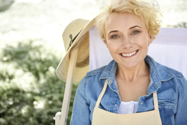 Woman resting on the lawn chair