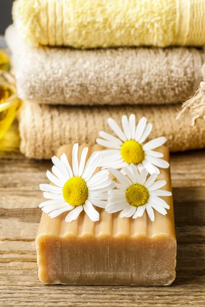 Handmade bars of soap and chamomile flowers