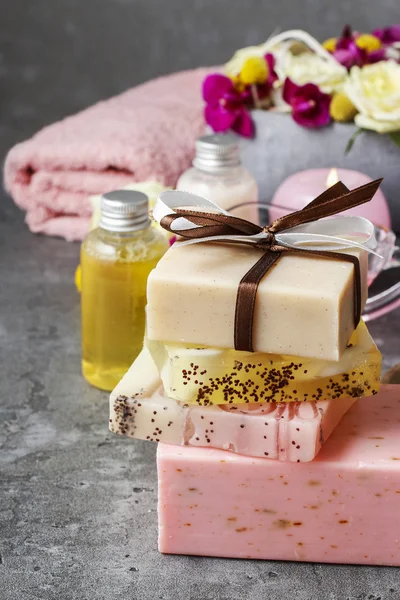 Spa set: bars of handmade soap and bottle of essential oil