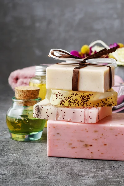 Spa set: bars of handmade soap and bottle of essential oil