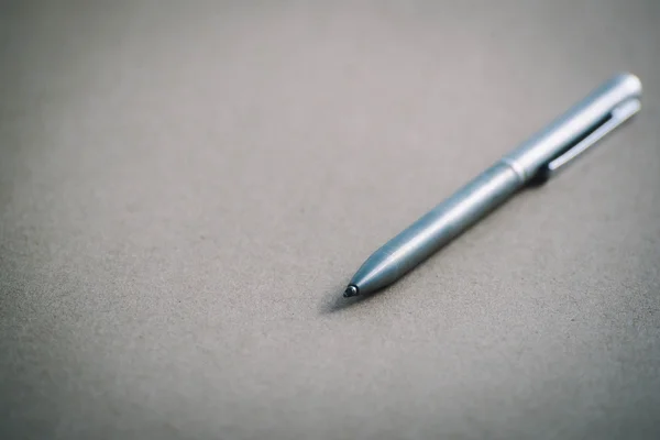 Vintage pen on brown paper,close-up