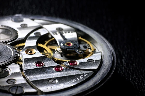 Pocket watch inside with rubies close up
