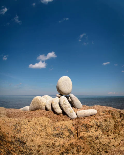 Figurine on coast