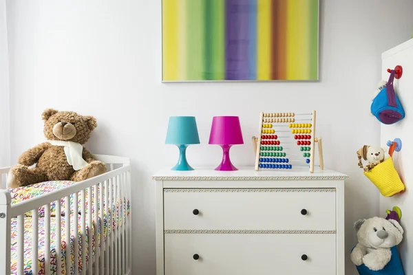 Child room with cradle, chest of drawers