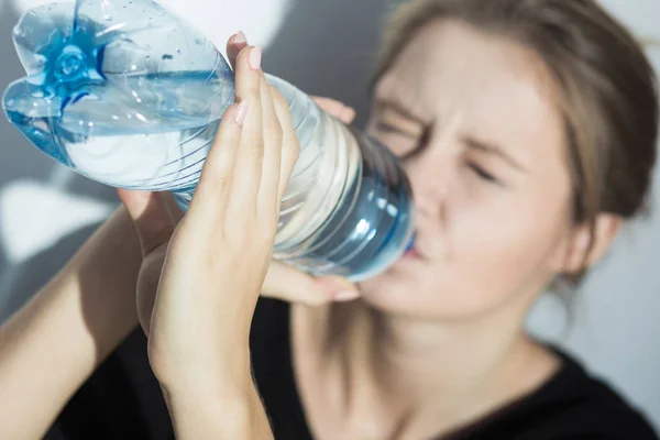 Anorexic girl drinking water