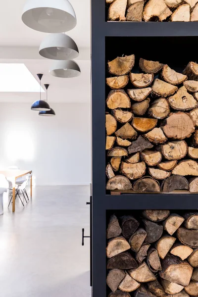 Rack to store firewood in white living room