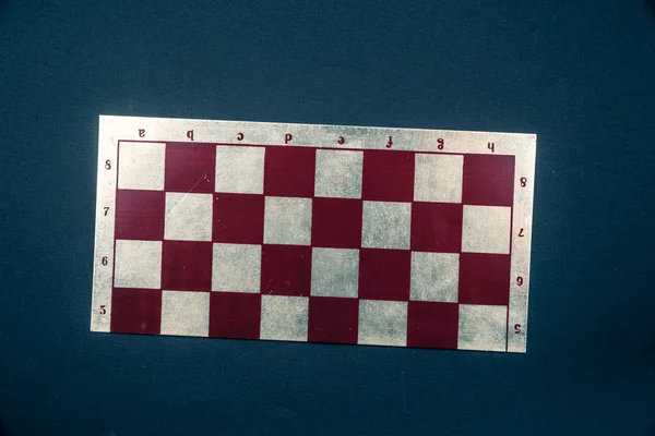 Chess board on dark background.